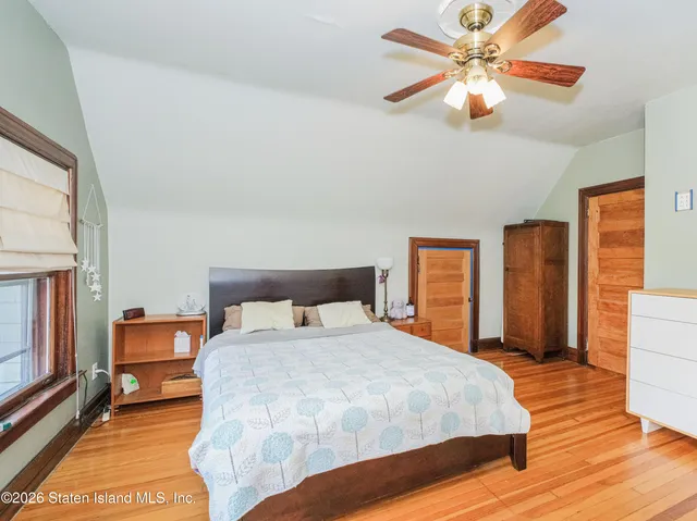 a bed room with a bed and a chandelier