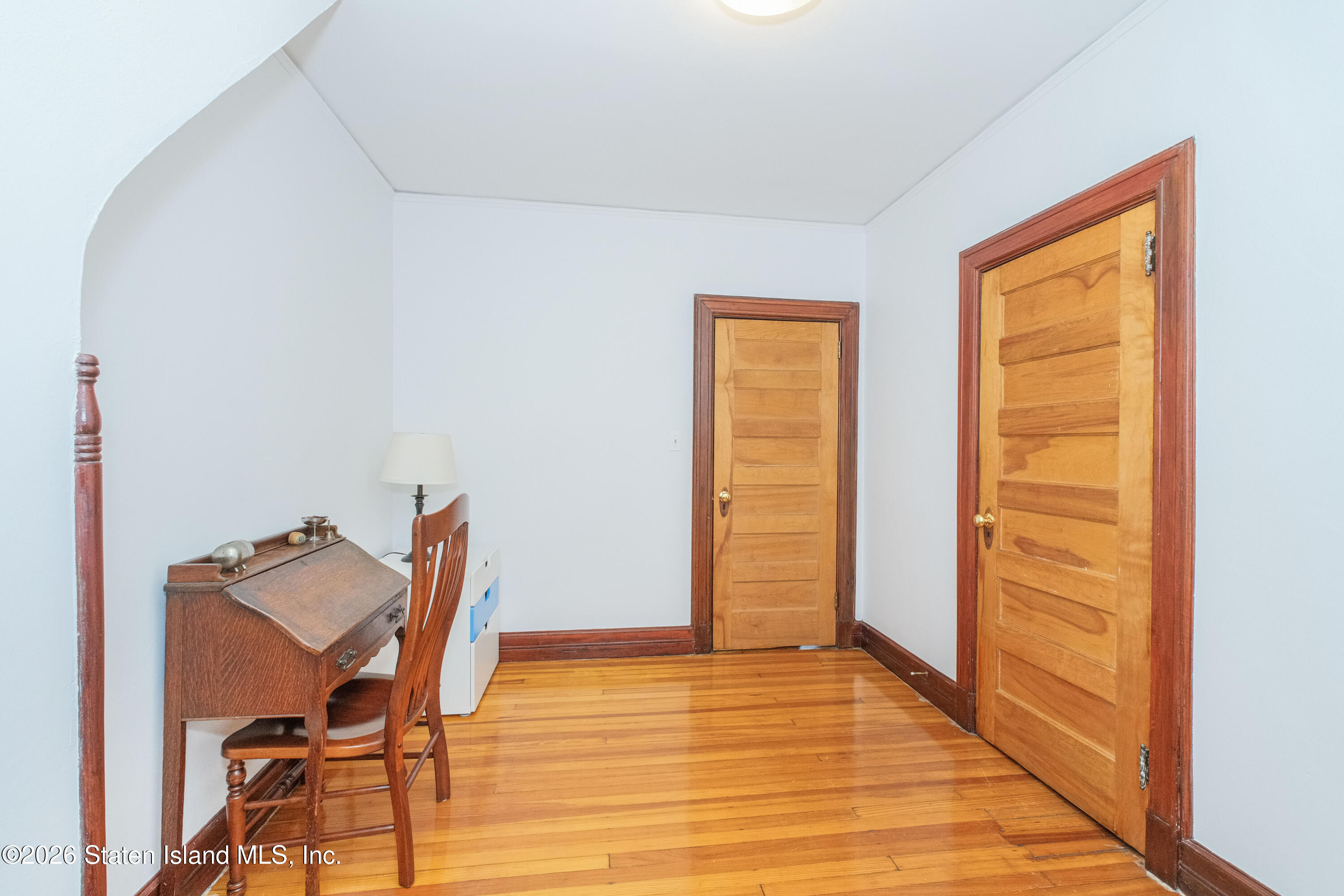 98 Hamilton Avenue Staten Island, NY 10301 - Photo 19 of 55 a view of a room with lounge chair and wooden floor