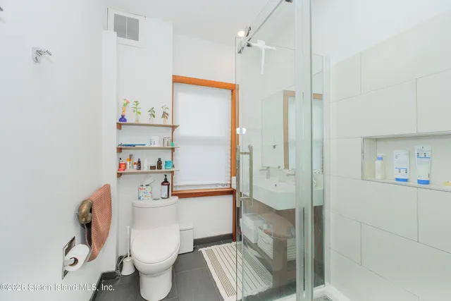 a view of a bathroom from a hallway