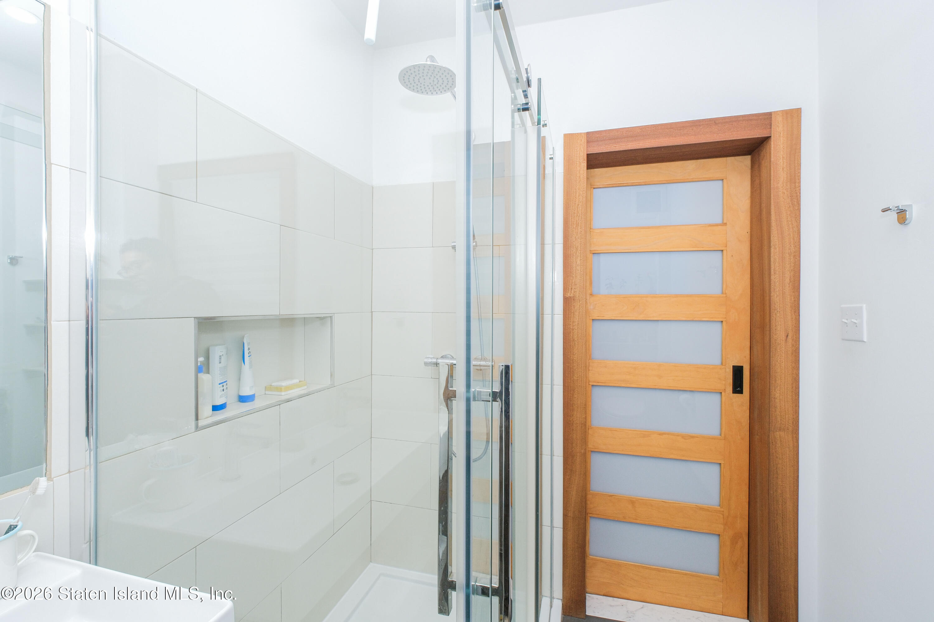 98 Hamilton Avenue Staten Island, NY 10301 - Photo 23 of 55 a view of a bathroom from a hallway