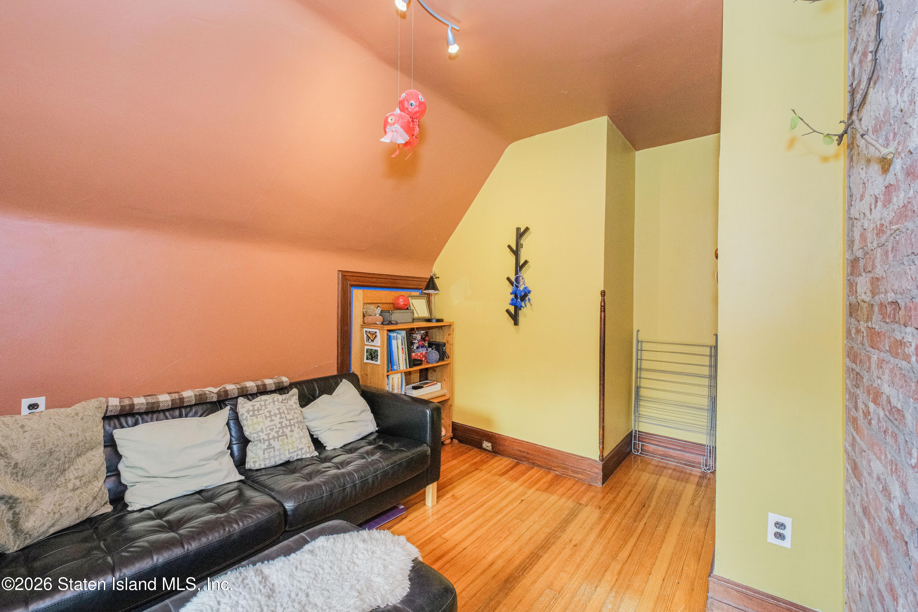 98 Hamilton Avenue Staten Island, NY 10301 - Photo 27 of 55 a living room with furniture and a wooden floor