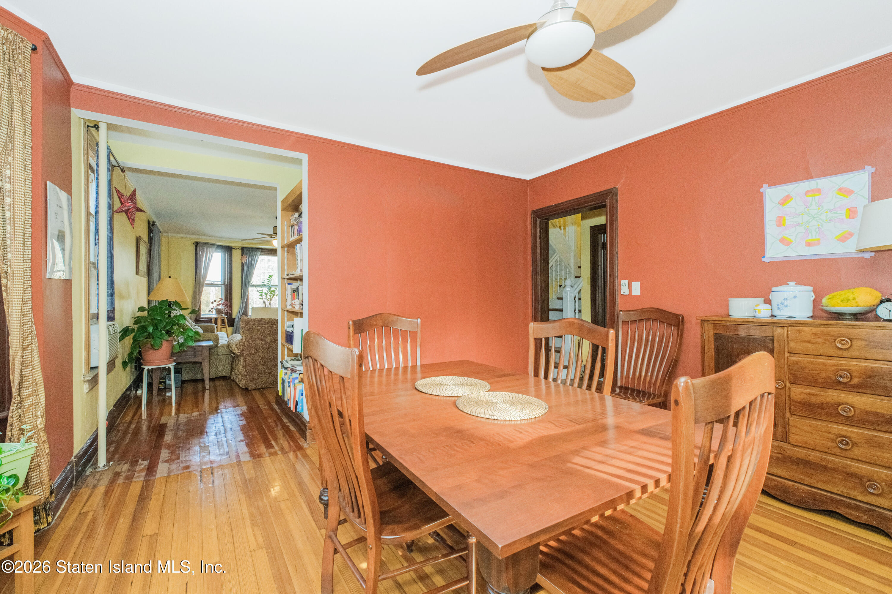 98 Hamilton Avenue Staten Island, NY 10301 - Photo 32 of 55 a dining room with furniture and wooden floor