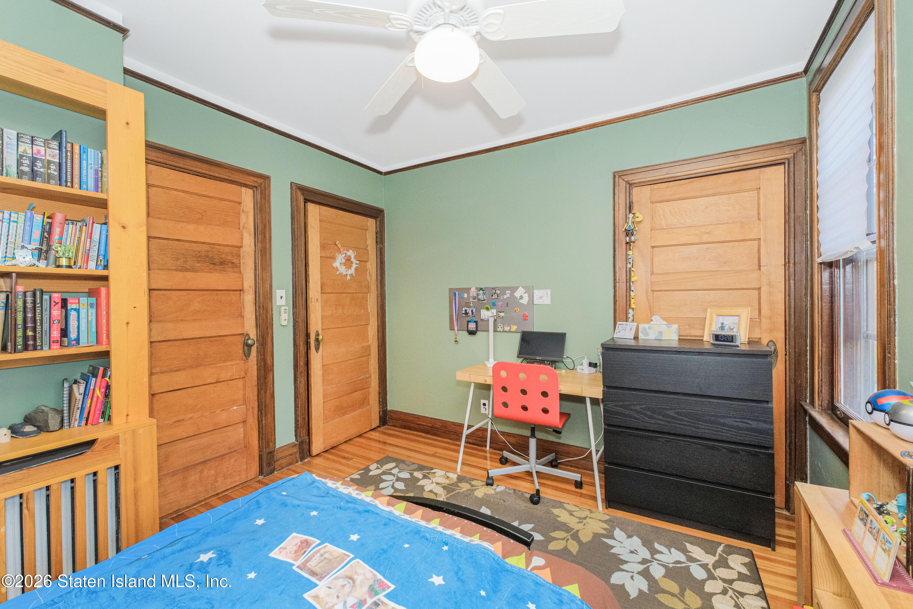 98 Hamilton Avenue Staten Island, NY 10301 - Photo 36 of 55 a bedroom with a bed and a window