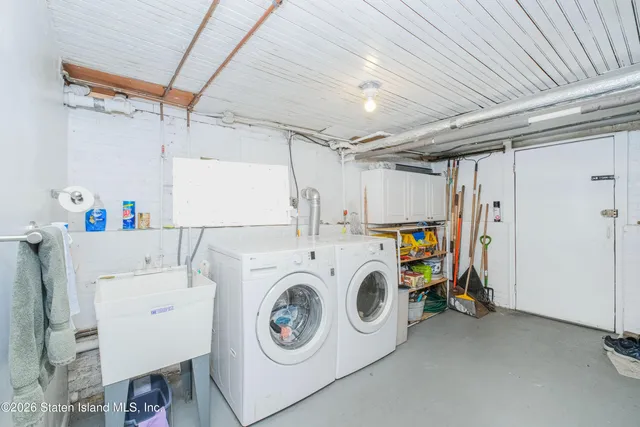 a bathroom with a sink mirror and toilet