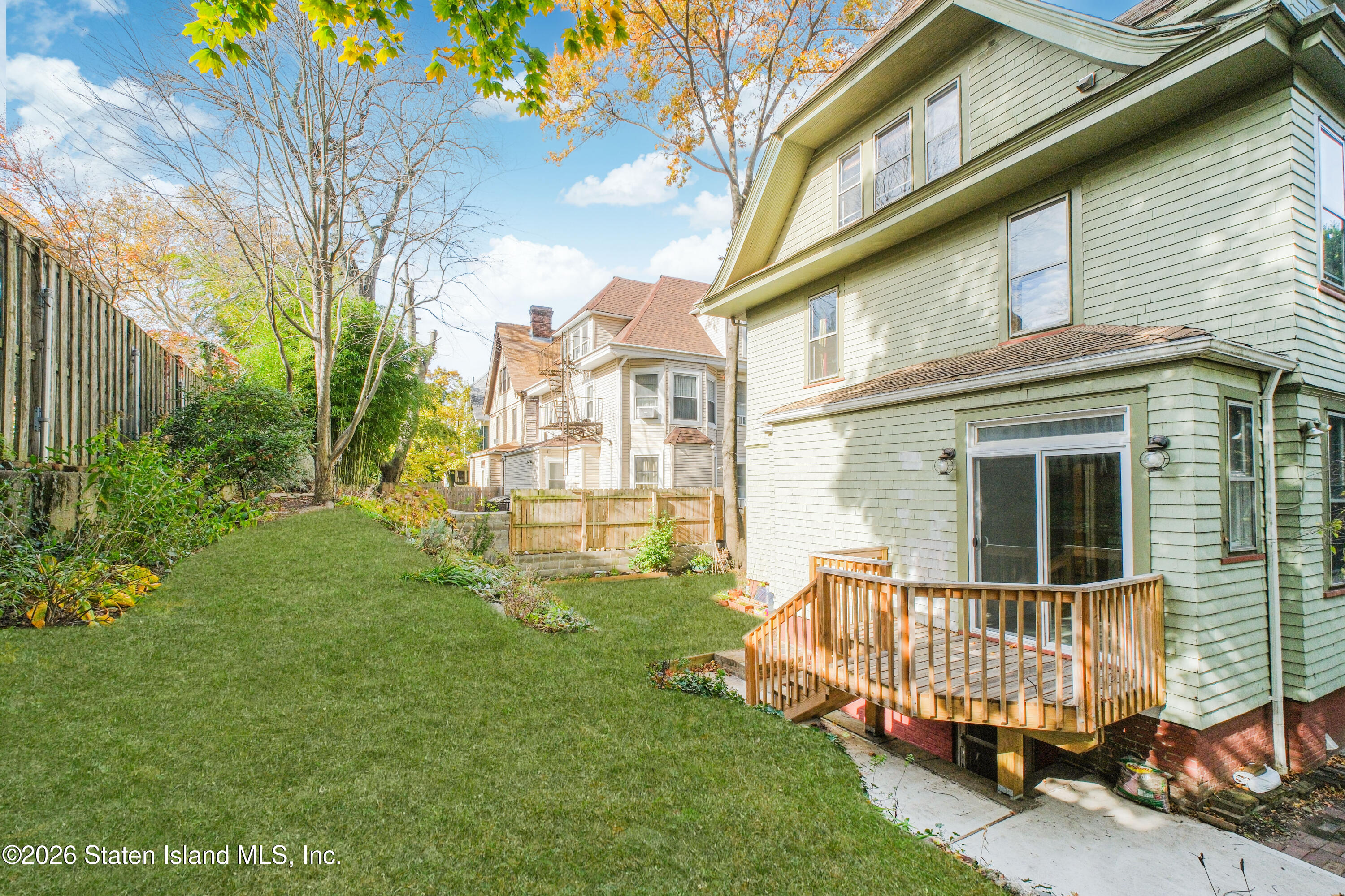 98 Hamilton Avenue Staten Island, NY 10301 - Photo 46 of 55 a view of backyard with a garden and deck