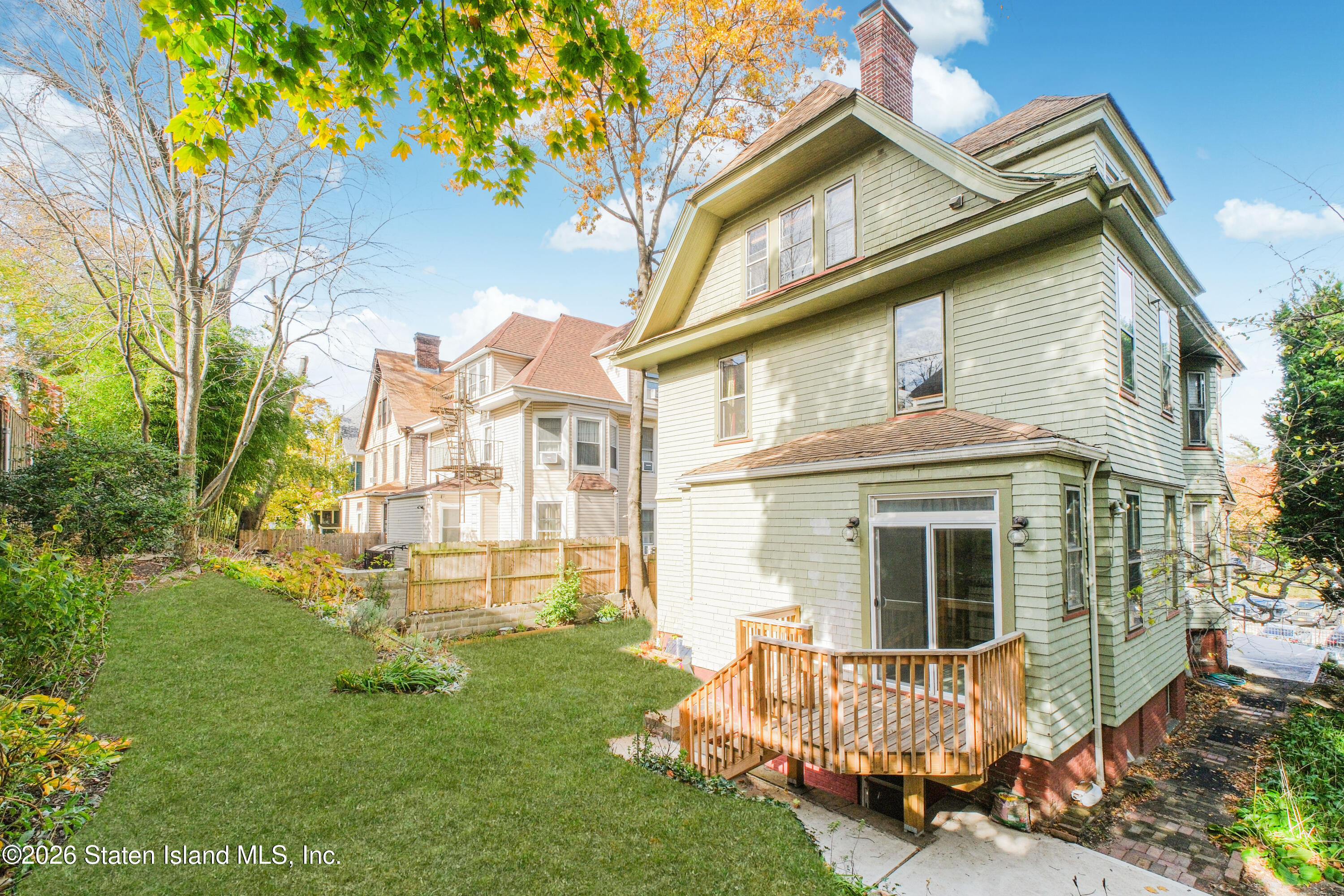 98 Hamilton Avenue Staten Island, NY 10301 - Photo 47 of 55 a view of a house with a yard and sitting area