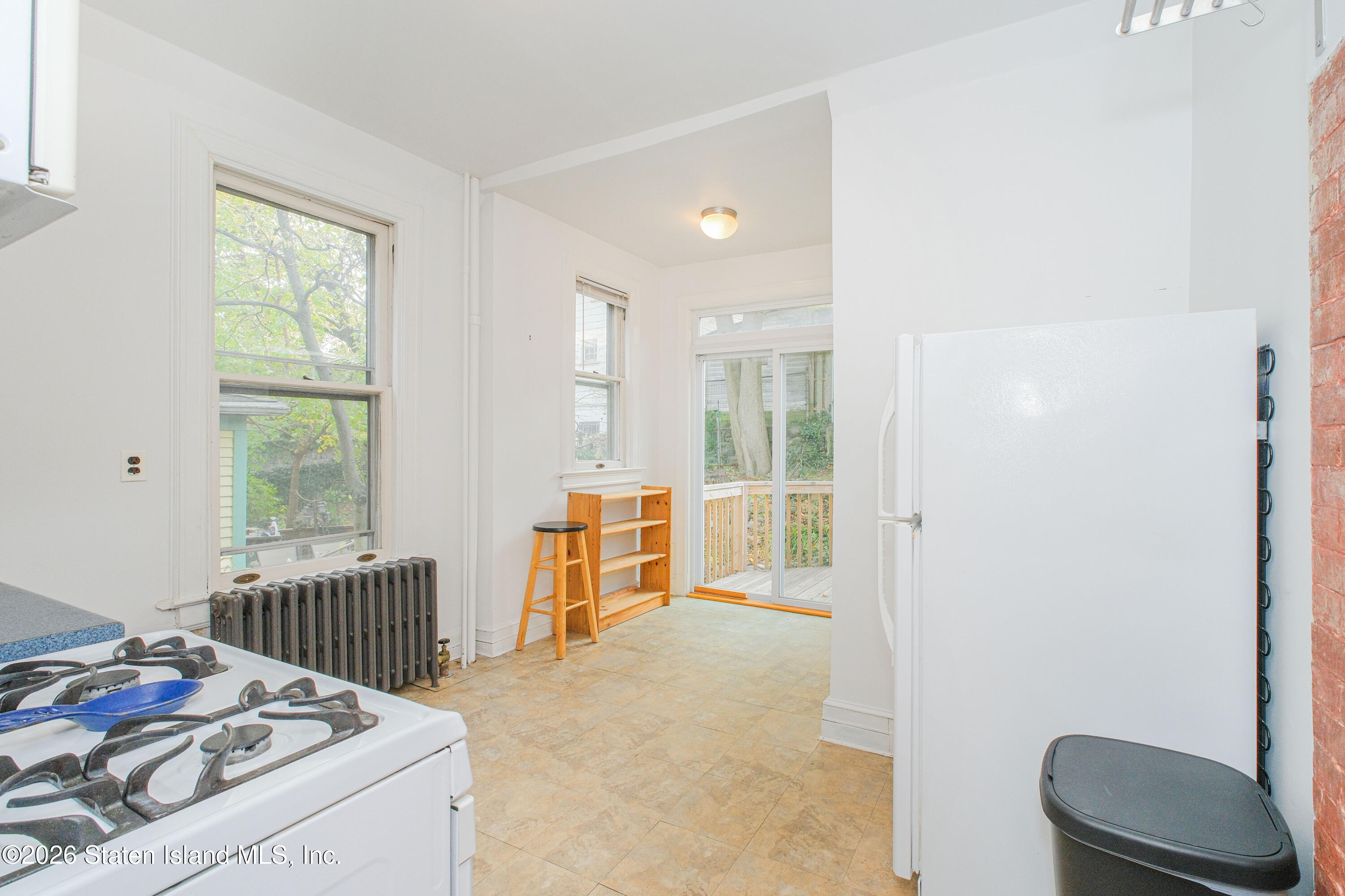 98 Hamilton Avenue Staten Island, NY 10301 - Photo 9 of 55 a bedroom with furniture and a window