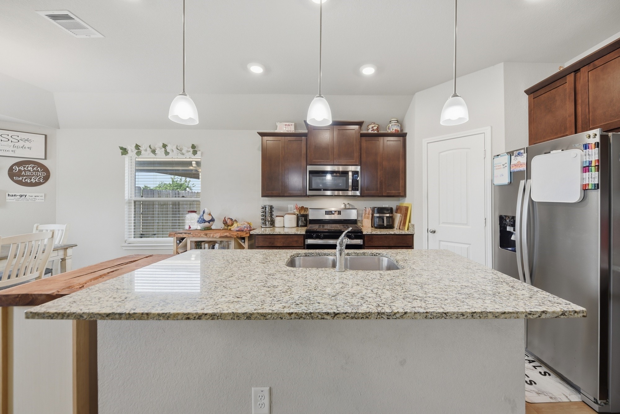 803 Davy Street Brenham, TX 77833 - Photo 8 of 26 Beautiful Island Kitchen with pendent lighting