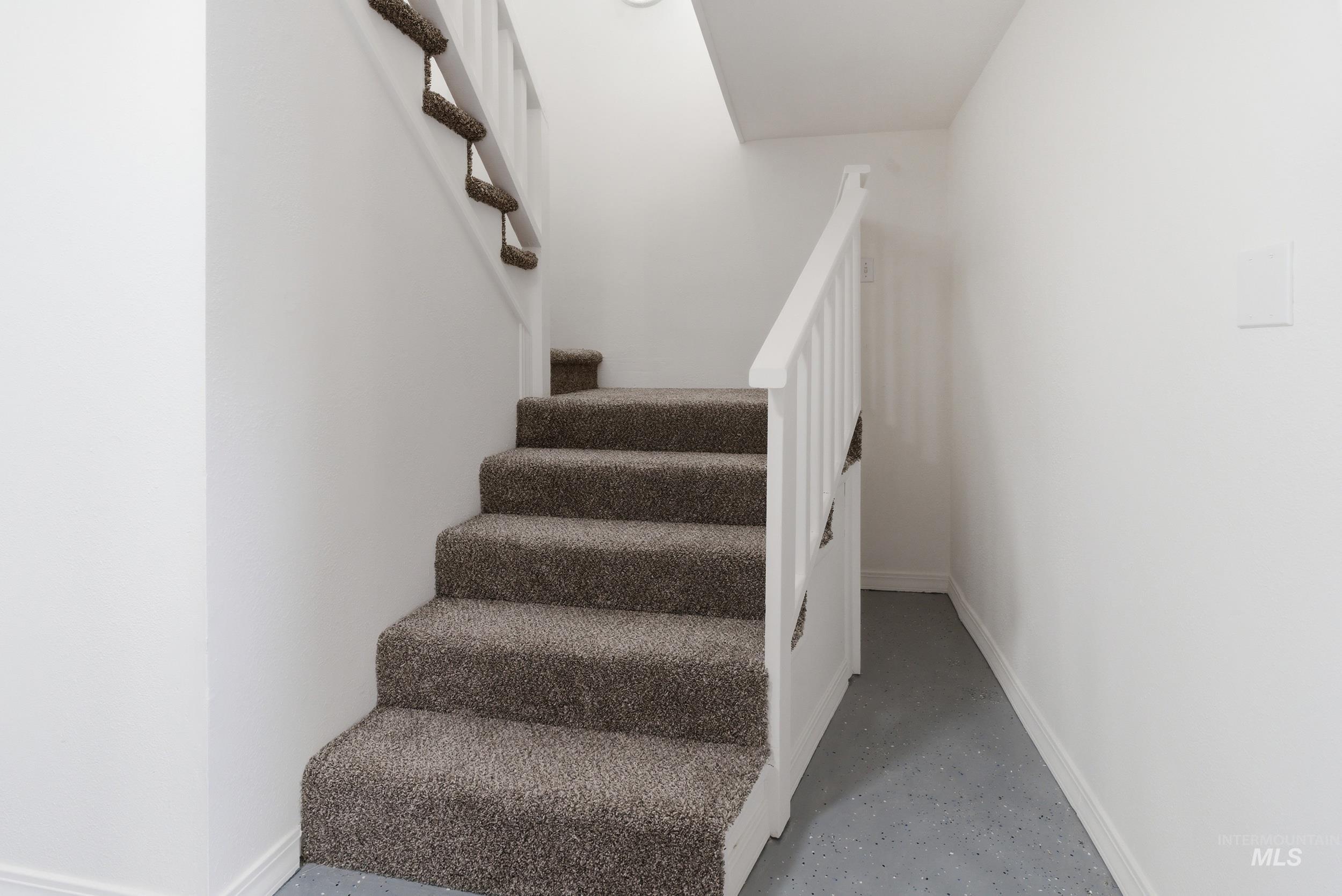 107 West Main Street Declo, ID 83323 - Photo 17 of 32 Stairway featuring baseboards and concrete flooring