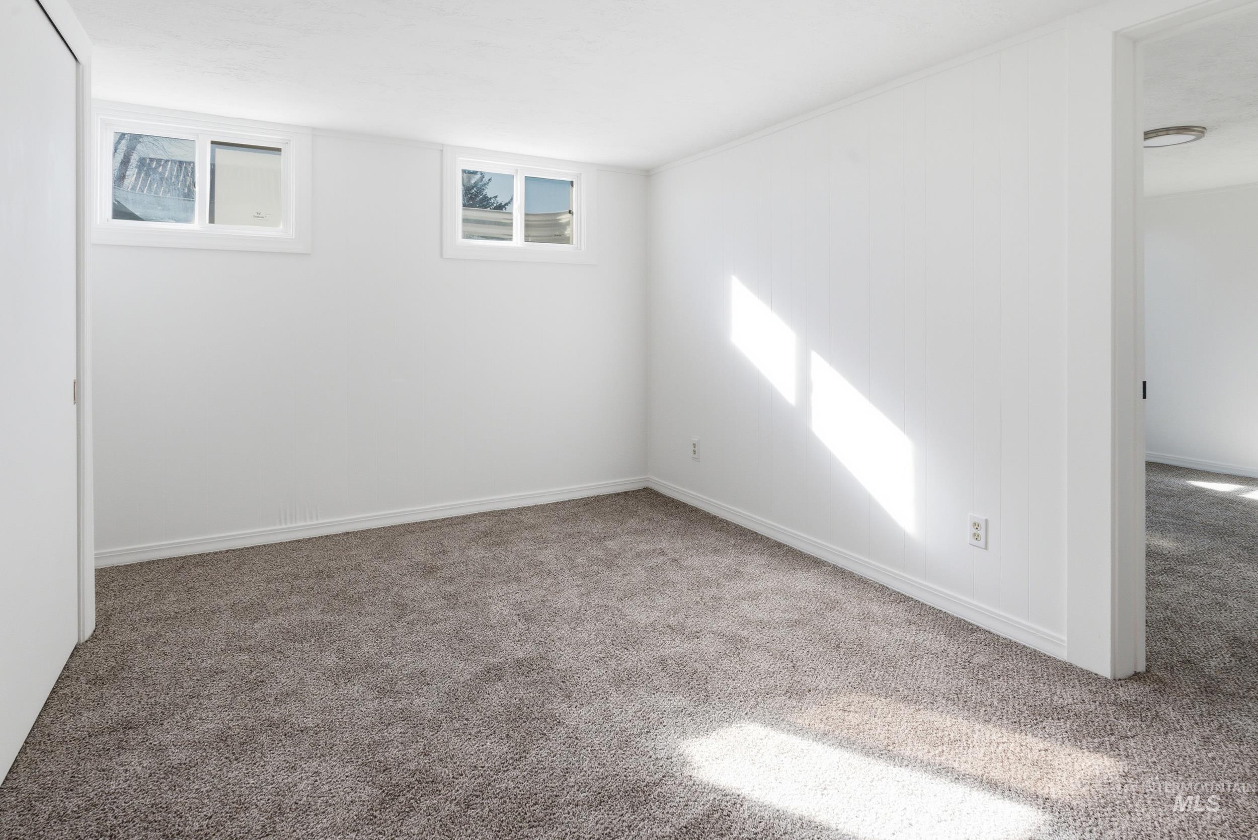 107 West Main Street Declo, ID 83323 - Photo 20 of 32 Spare room with carpet floors and baseboards