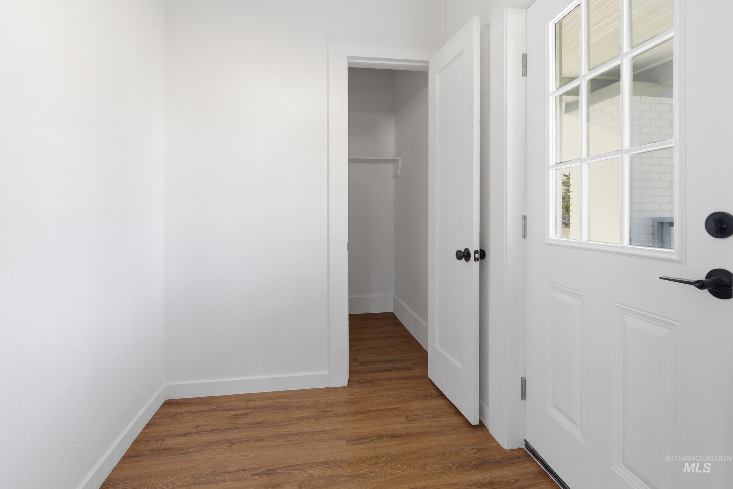 107 West Main Street Declo, ID 83323 - Photo 26 of 32 Hall featuring wood finished floors and baseboards