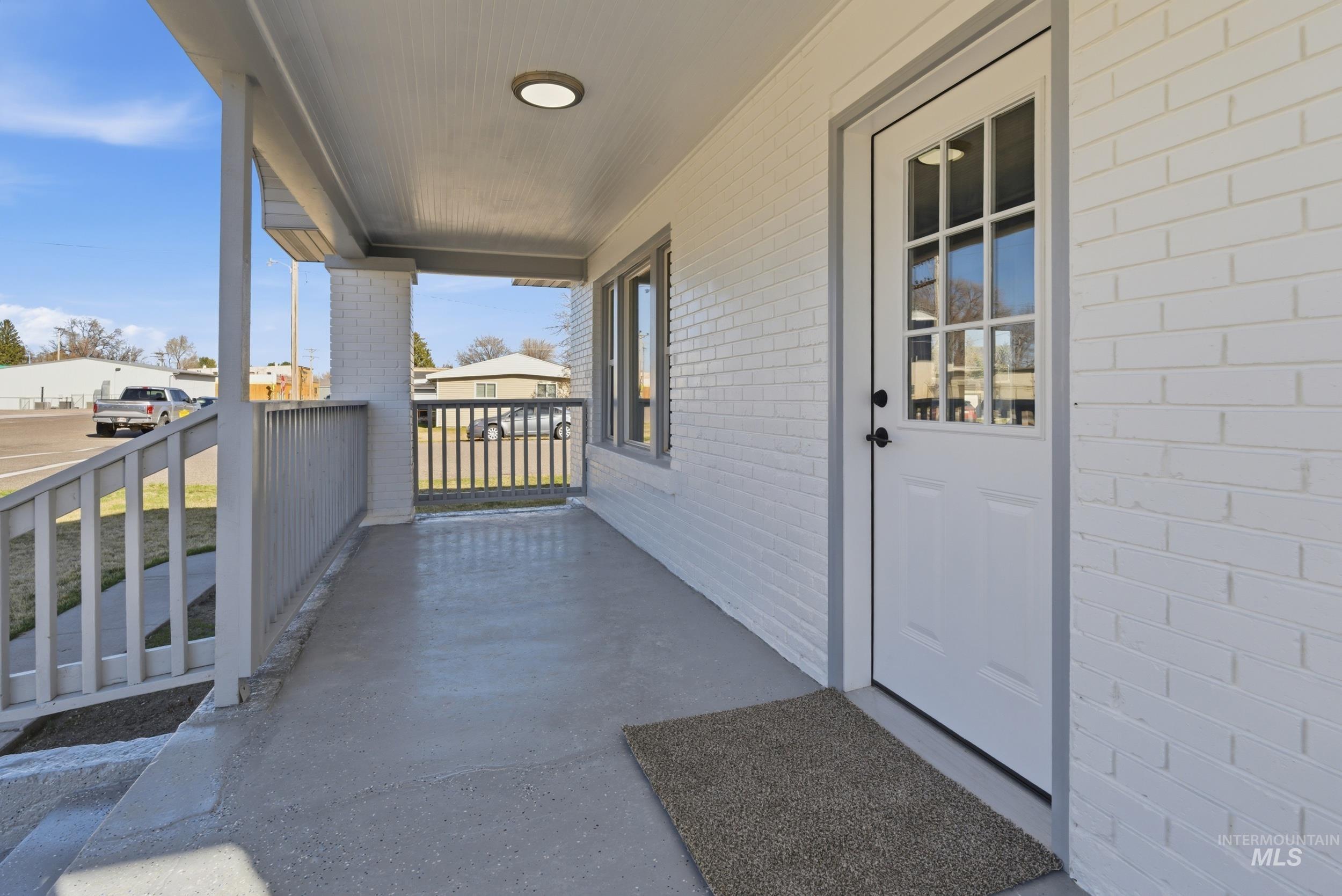 107 West Main Street Declo, ID 83323 - Photo 28 of 32 Entrance to property with brick siding and covered porch