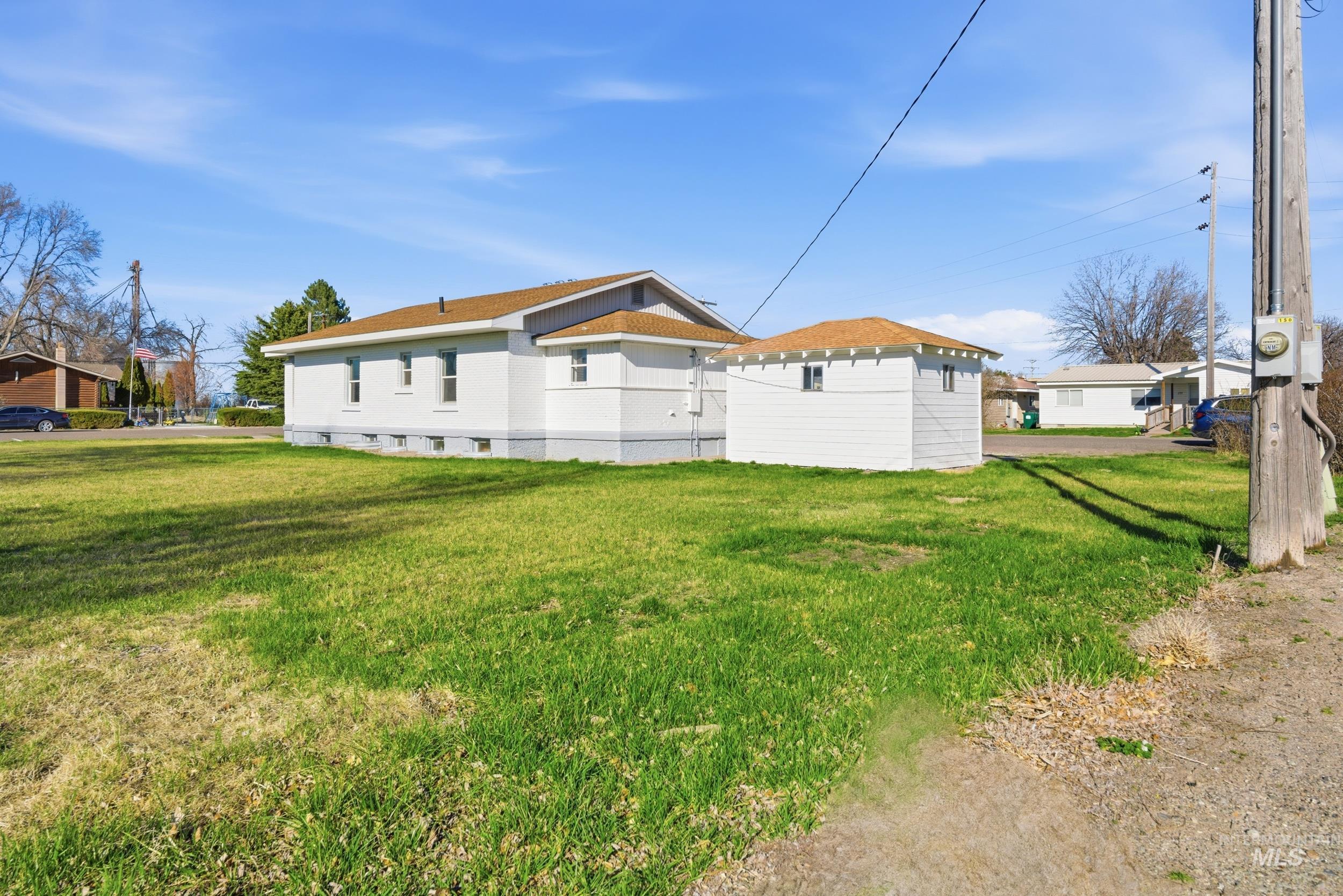 107 West Main Street Declo, ID 83323 - Photo 32 of 32 View of home's exterior featuring a lawn