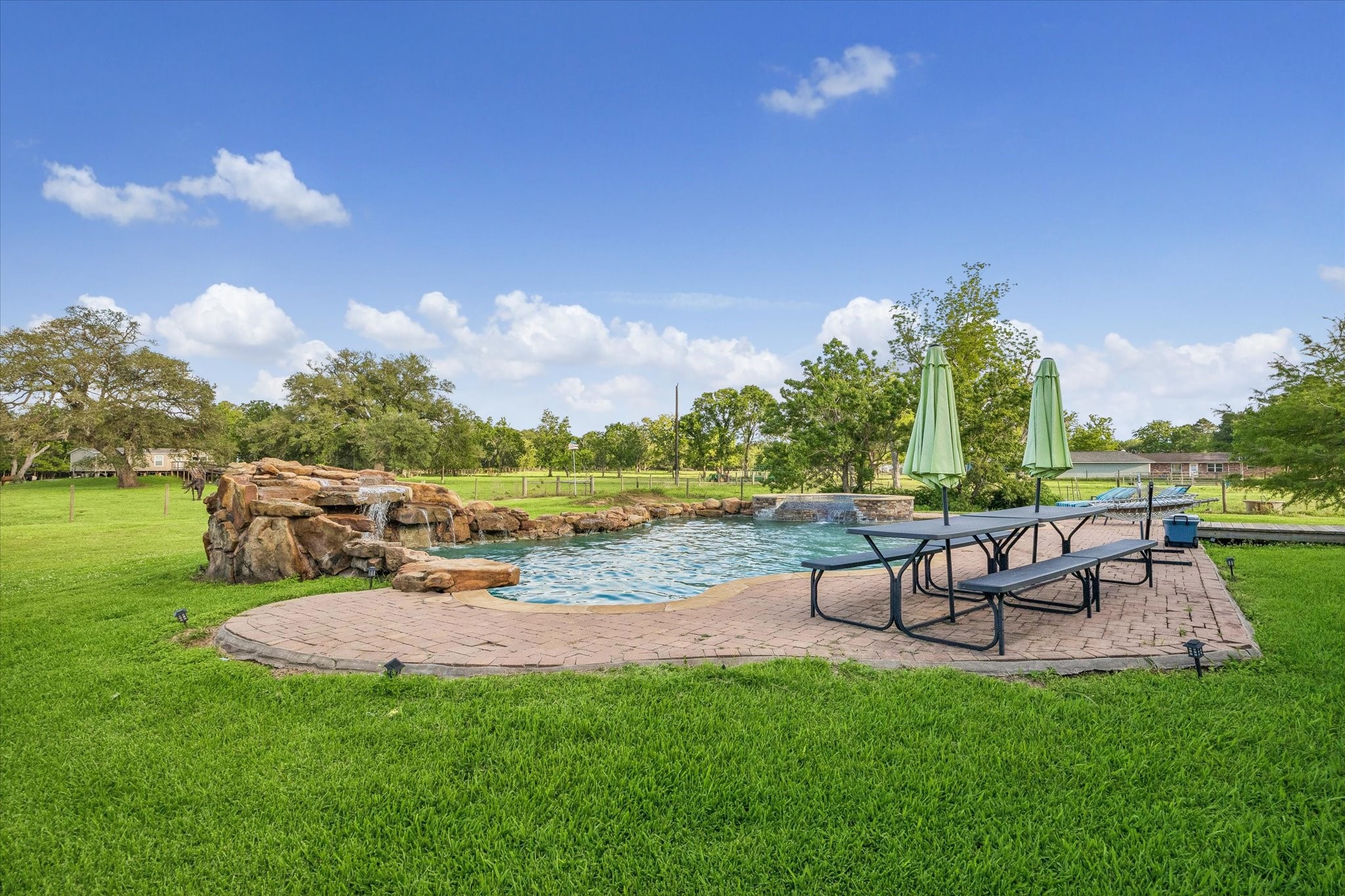 3515 County Road 36 Angleton, TX 77515 - Photo 39 of 50 a view of a swimming pool with a patio