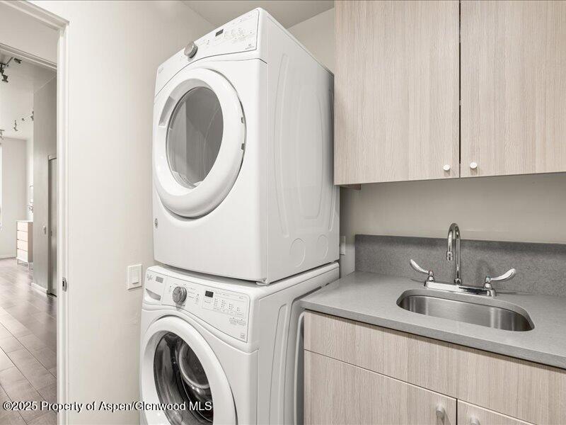 102 Evans Road, Unit 107 Basalt, CO 81621 - Photo 21 of 25 a kitchen with a sink and a washer dryer