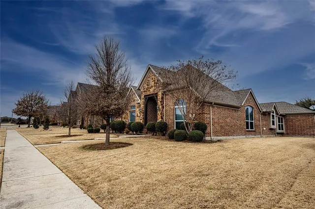 a view of a house with a snow in the yard