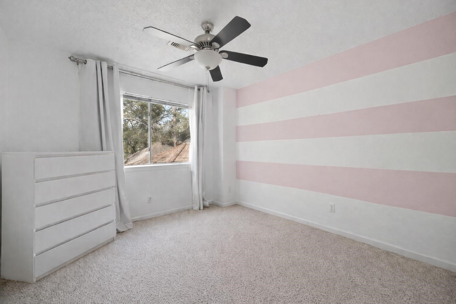 14907 Oak Bluff Court Houston, TX 77070 - Photo 16 of 19 Secondary bedroom with generous closet space.