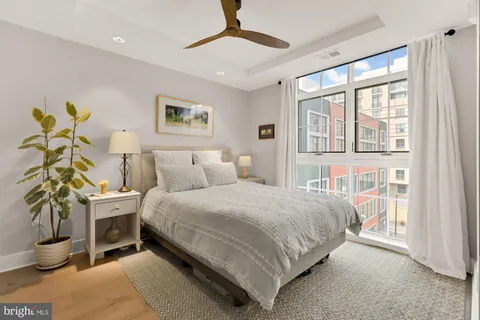 a bedroom with a bed and walk in closet