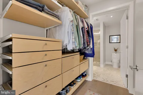 a bathroom with a sink mirror and toilet