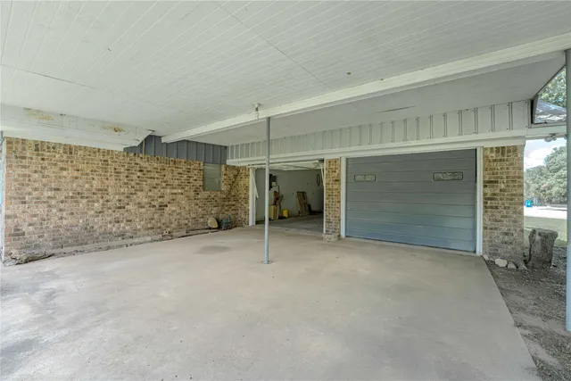 a view of an empty room with a garage