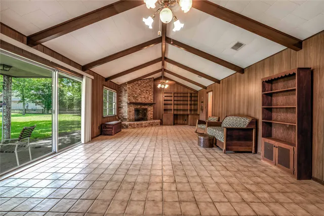 a view of a livingroom with furniture and staircase