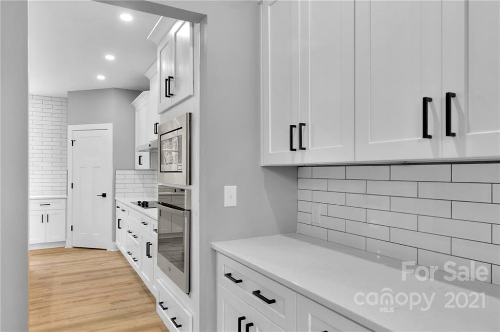 13500 Old Camden Road Midland, NC 28107 - Photo 11 of 41 a view of a kitchen with white cabinets