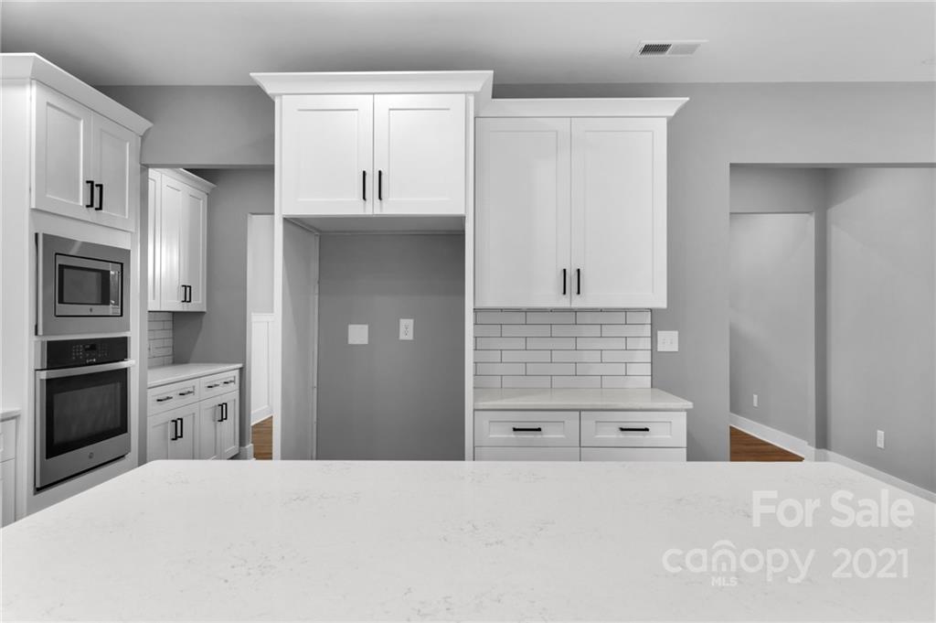 13500 Old Camden Road Midland, NC 28107 - Photo 20 of 41 a kitchen with stainless steel appliances a refrigerator and cabinets