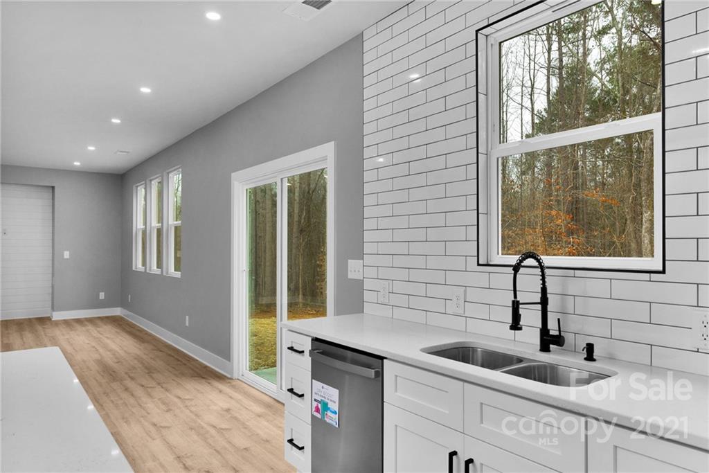 13500 Old Camden Road Midland, NC 28107 - Photo 21 of 41 a kitchen with a sink and large window