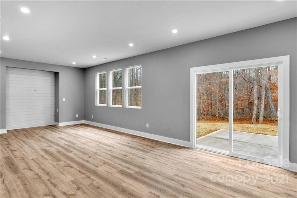 13500 Old Camden Road Midland, NC 28107 - Photo 24 of 41 a view of empty room with wooden floor and fan