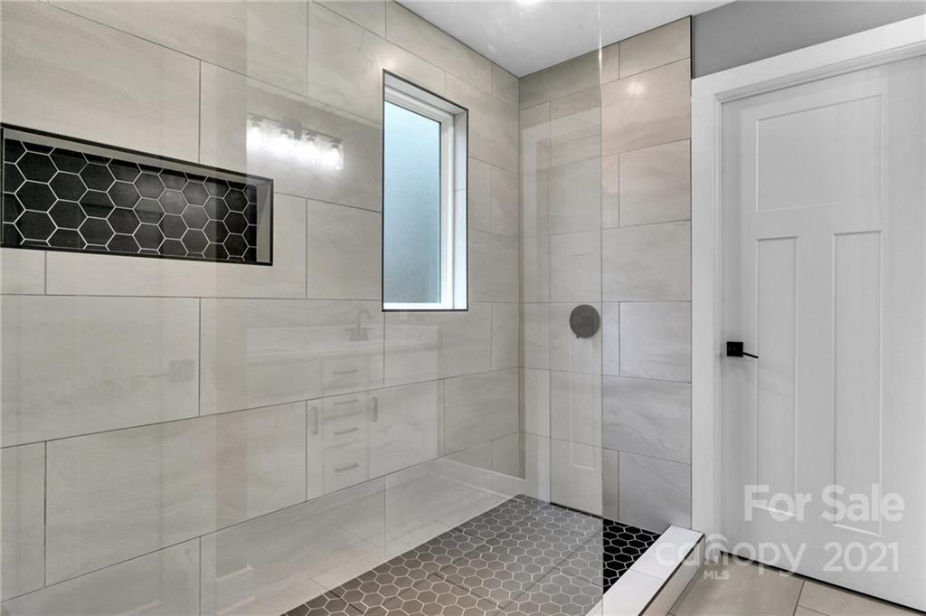 13500 Old Camden Road Midland, NC 28107 - Photo 30 of 41 a bathroom with a shower