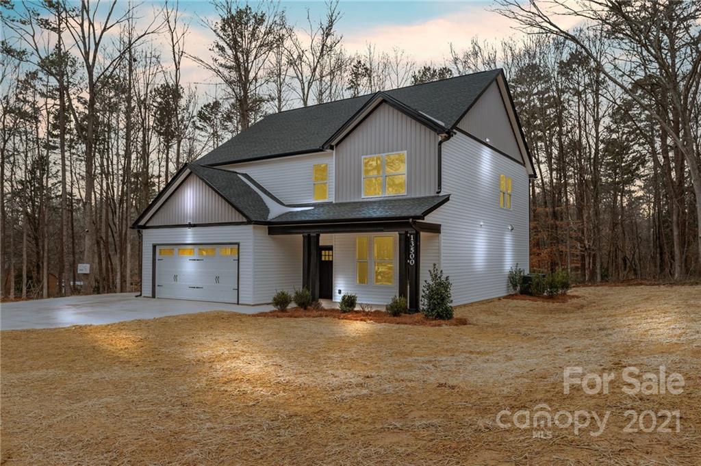 13500 Old Camden Road Midland, NC 28107 - Photo 3 of 41 a view of a house with basketball court