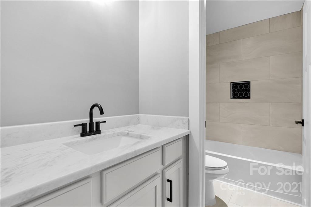 13500 Old Camden Road Midland, NC 28107 - Photo 38 of 41 a bathroom with a sink and a mirror