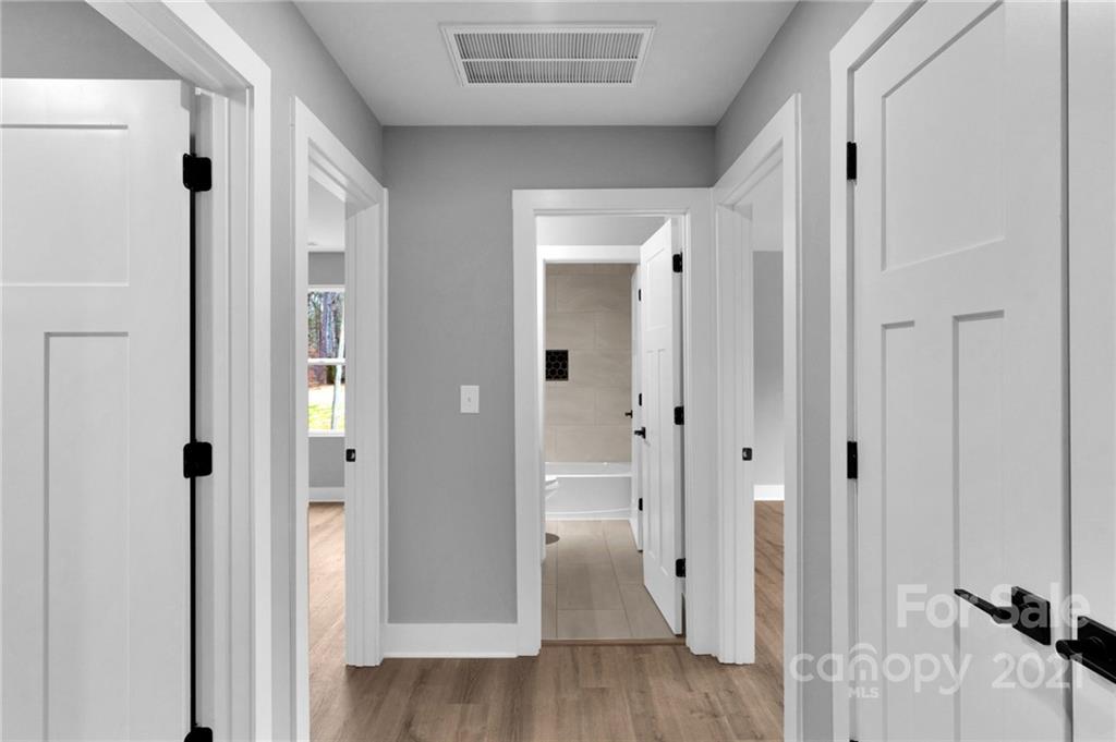 13500 Old Camden Road Midland, NC 28107 - Photo 40 of 41 a view of a bathroom with a shower and a tub