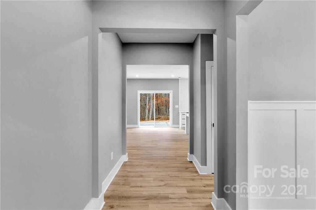 13500 Old Camden Road Midland, NC 28107 - Photo 6 of 41 a view of a hallway with wooden floor and a hallway