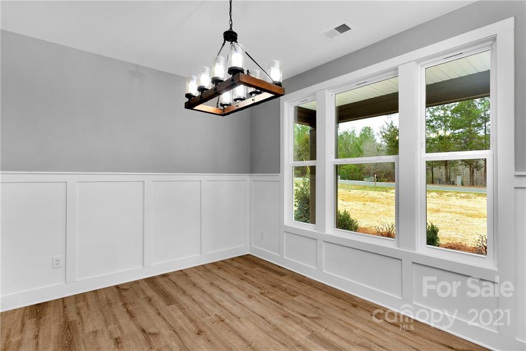 13500 Old Camden Road Midland, NC 28107 - Photo 8 of 41 a view of a room with wooden floor and windows