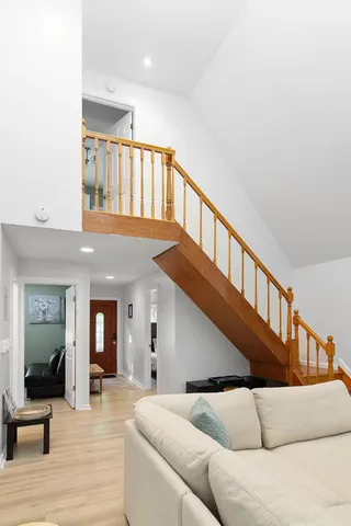 a view of livingroom and dining room with wooden floor