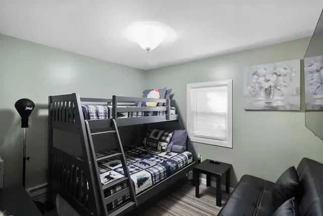 a bed room with furniture and a window