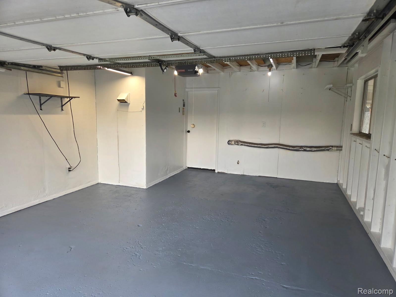 6443 Richfield Road Flint, MI 48506 - Photo 39 of 40 Garage with a garage door opener