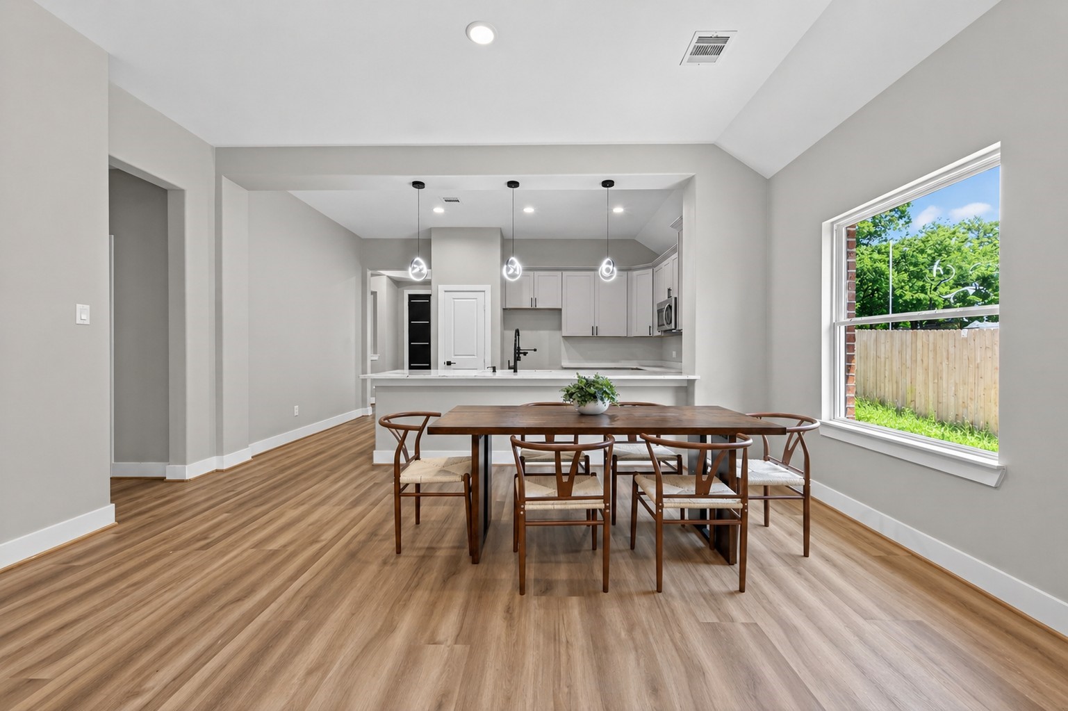 12431 Green Ridge Drive Willis, TX 77318 - Photo 8 of 37 Open dining area seamlessly connected to the living space, ideal for gatherings and everyday meals.