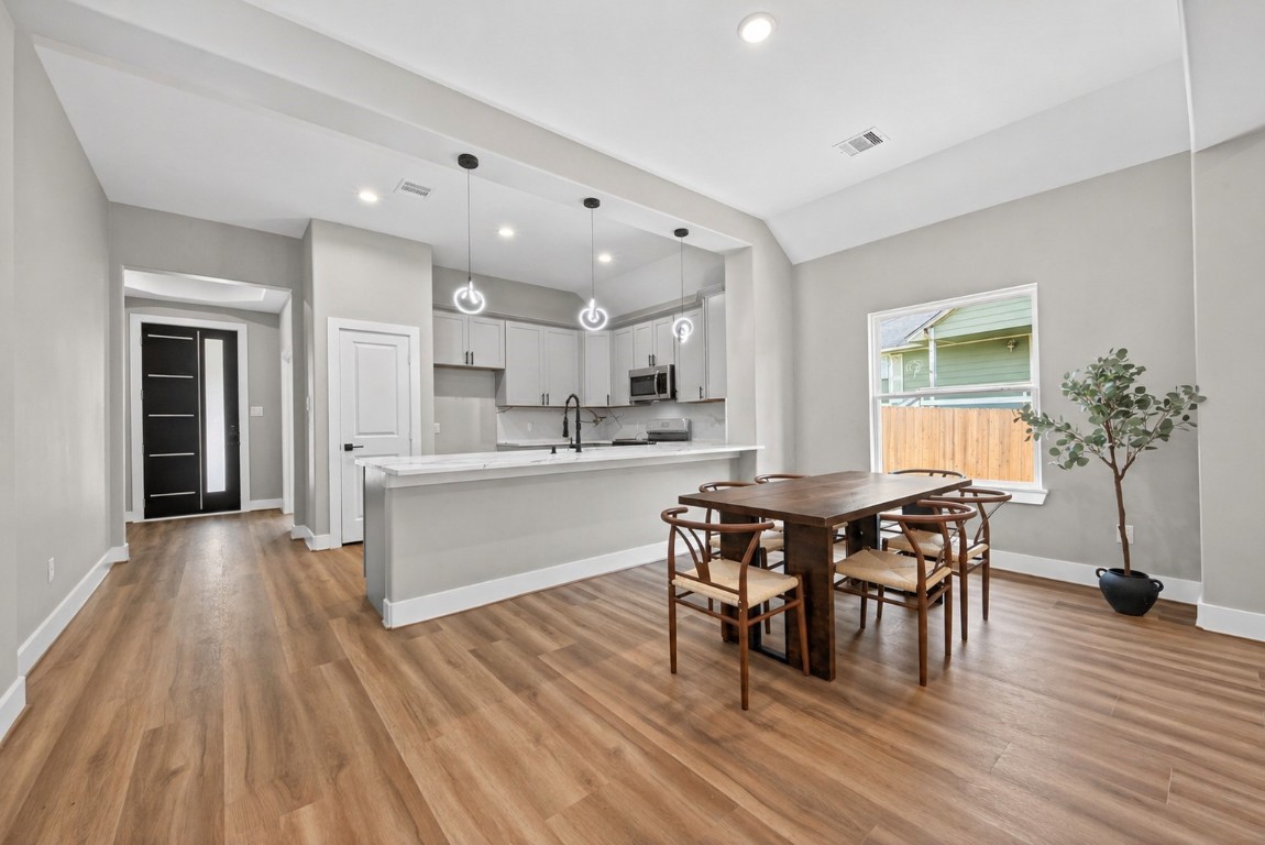 12431 Green Ridge Drive Willis, TX 77318 - Photo 9 of 37 Open dining area seamlessly connected to the living space, ideal for gatherings and everyday meals.