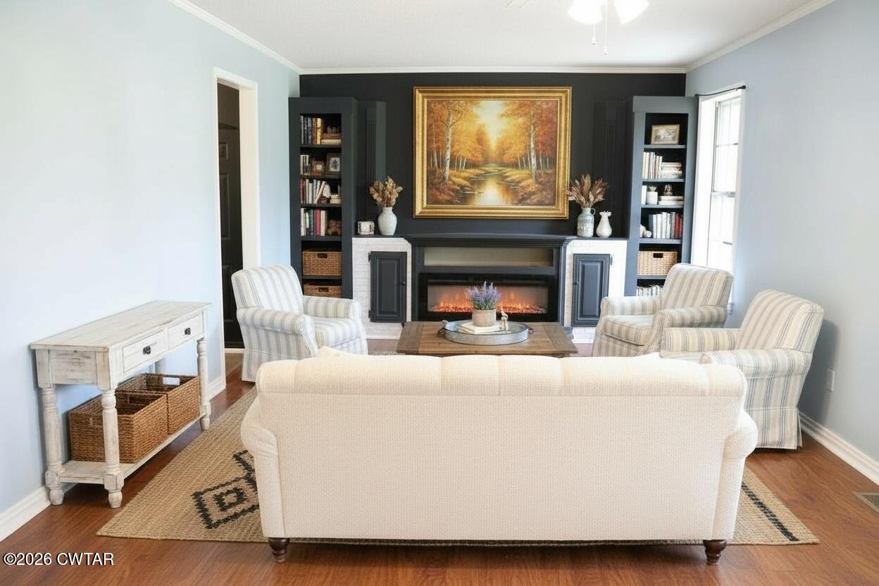 513 Viar Road Dyersburg, TN 38024 - Photo 8 of 37 a living room with furniture a fireplace and a flat screen tv