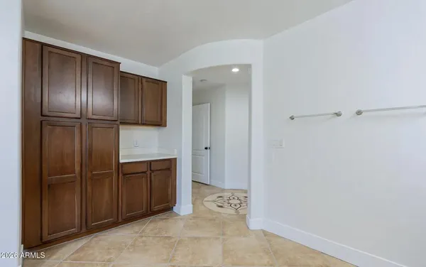 a spacious bathroom with a tub sink shower and mirror