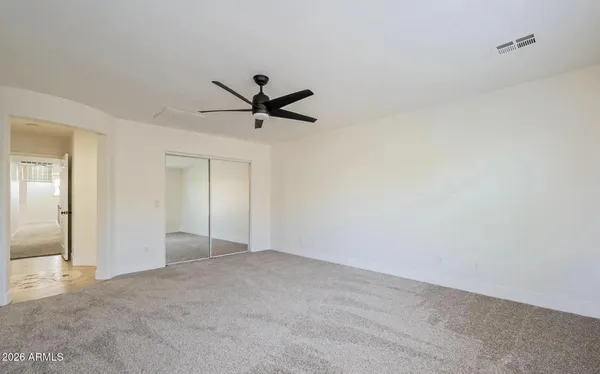 a view of empty room with windows
