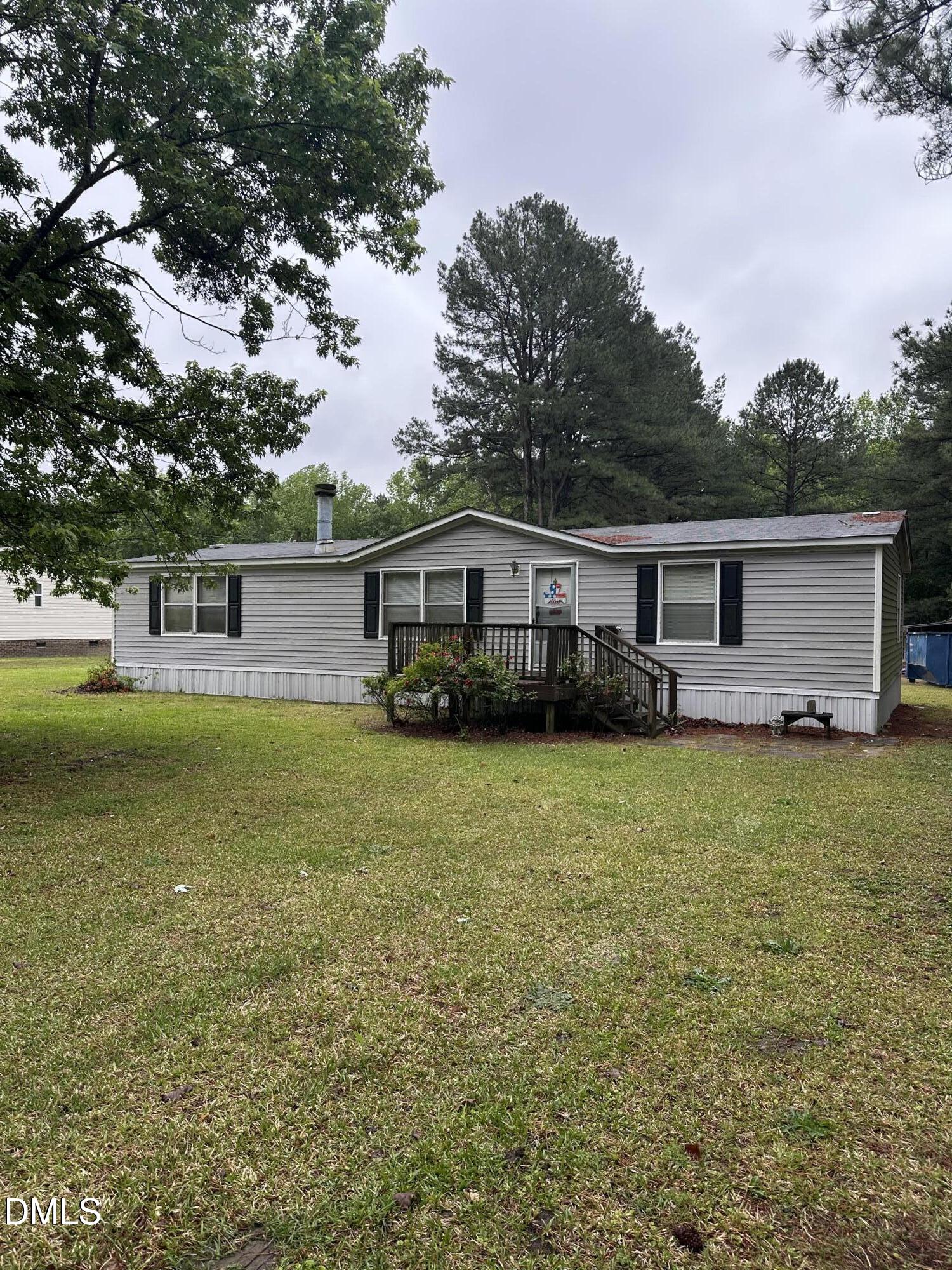 550 Phillips Road Selma, NC 27576 - Photo 1 of 16 a front view of house with yard space and seating area
