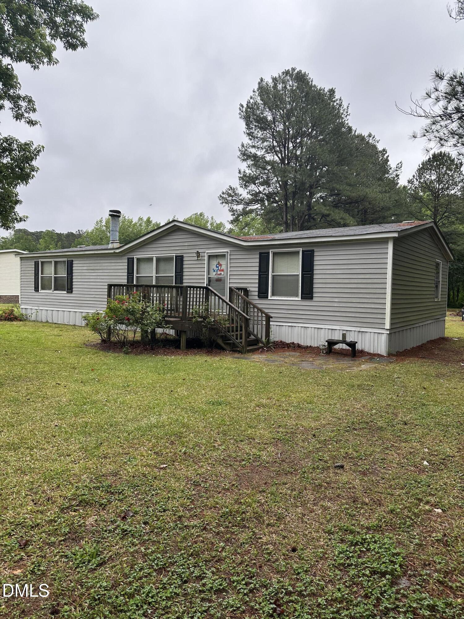 550 Phillips Road Selma, NC 27576 - Photo 2 of 16 a front view of house with yard and outdoor seating