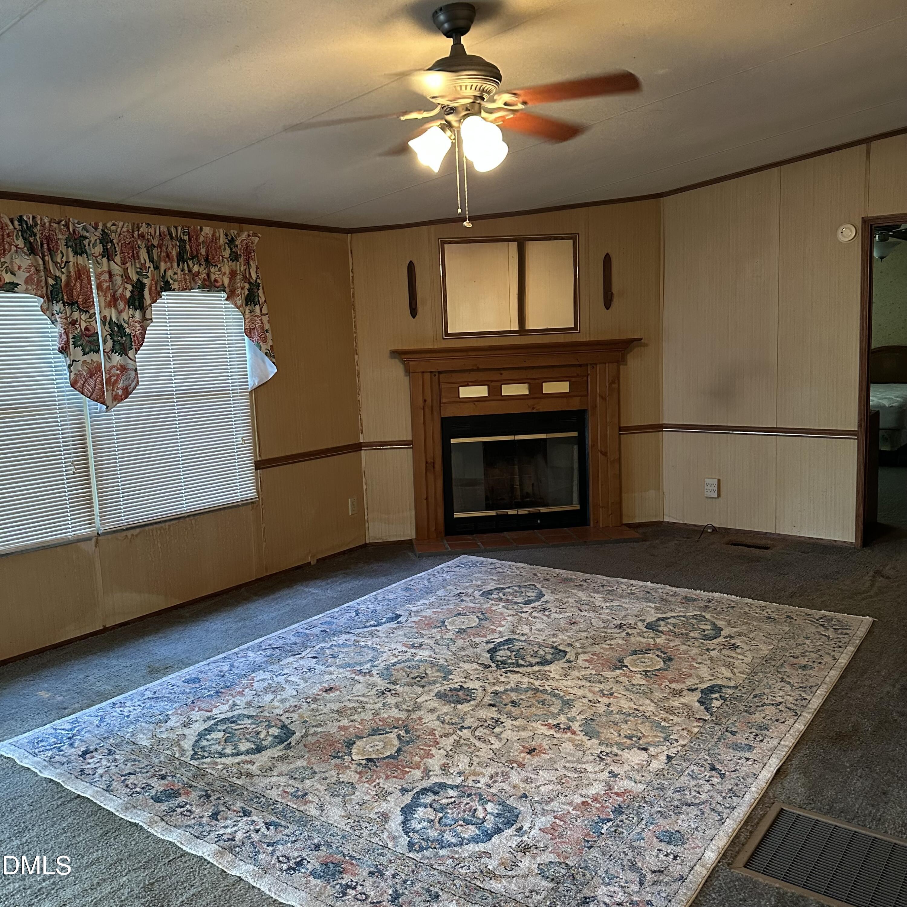 550 Phillips Road Selma, NC 27576 - Photo 5 of 16 a living room with a fireplace