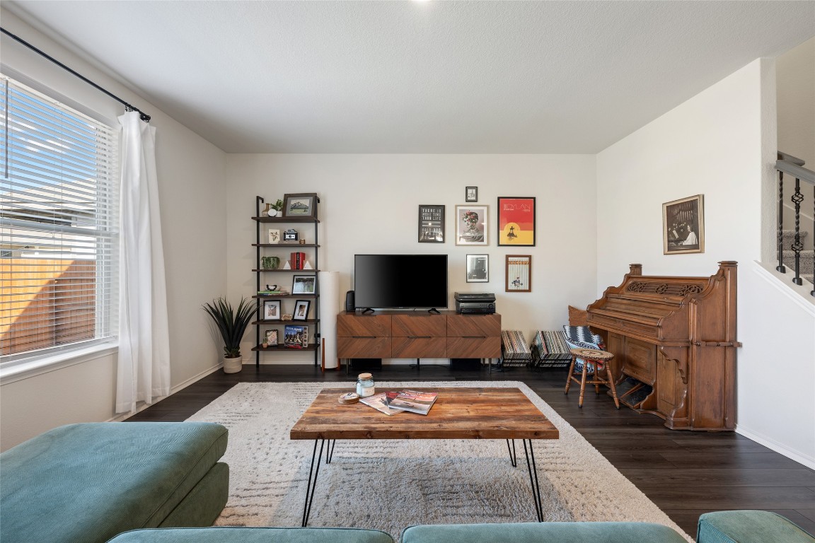 128 Sugarberry Drive Buda, TX 78610 - Photo 1 of 1 a living room with furniture and a flat screen tv
