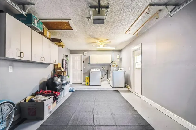 a hallway with a white cabinets