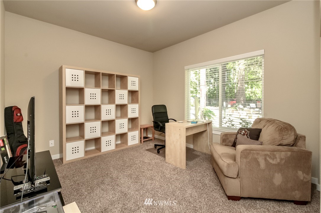 11414 Tower Road Southwest Lakewood, WA 98498 - Photo 14 of 19 a living room with furniture and a window