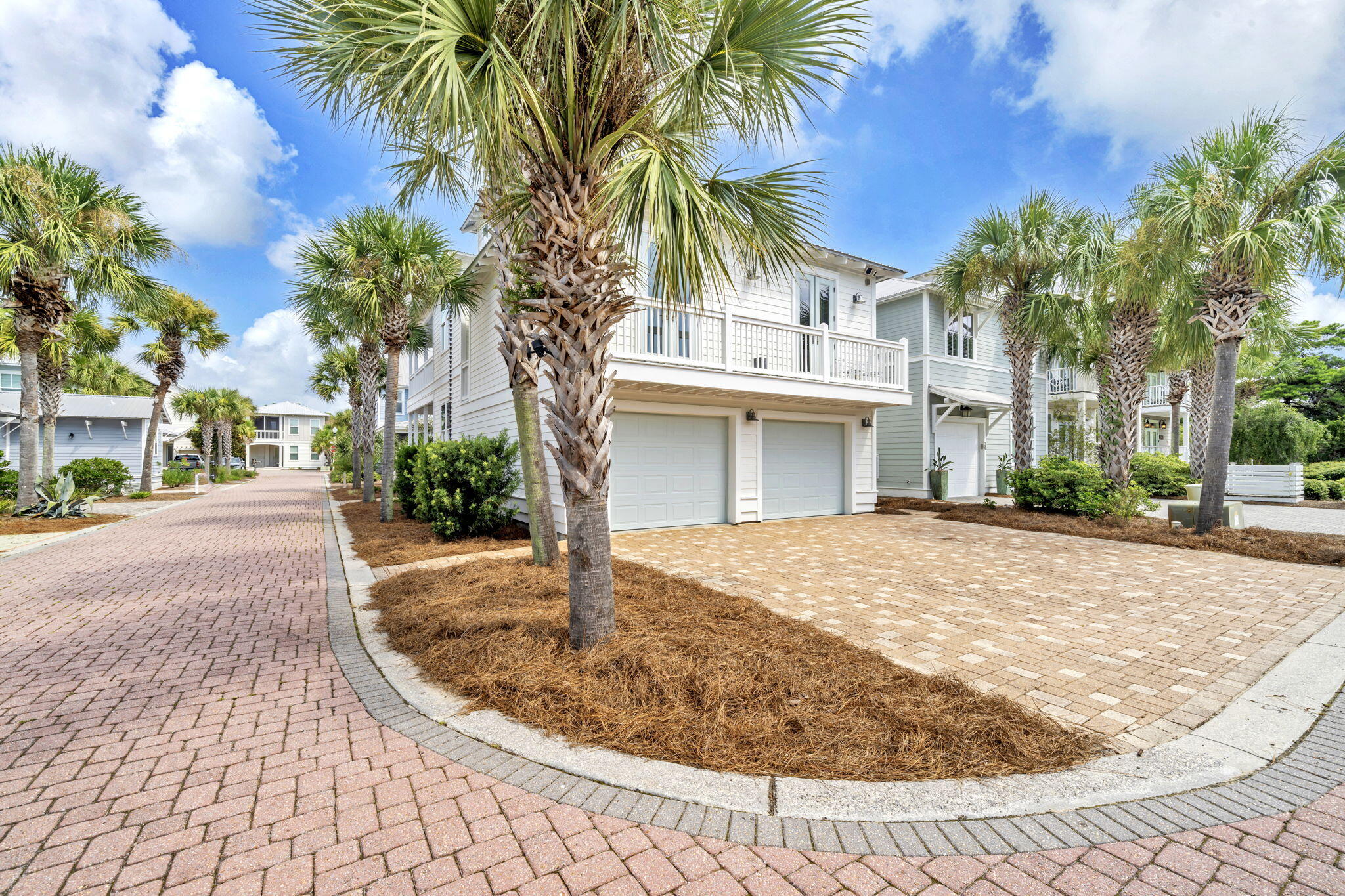 36 Moonlight Beach Lane Inlet Beach, FL 32461 - Photo 2 of 60 a view of a white house with a small yard and palm trees